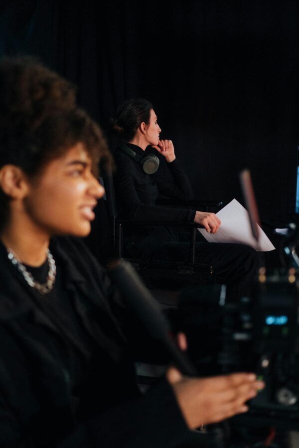 Focused film crew members work passionately on set, creating cinema magic.
